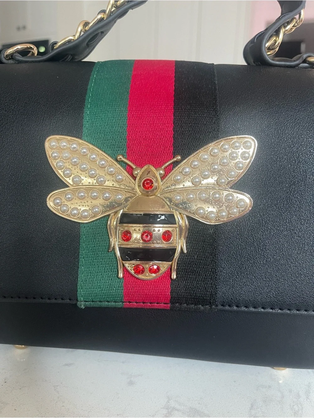 Black Top-Handle Satchel with Red-Green Stripe and Gold Bee Accent